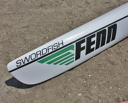 Fenn Swordfish, bow and hull decal close-up on the beach, original green-on-white Fenn livery