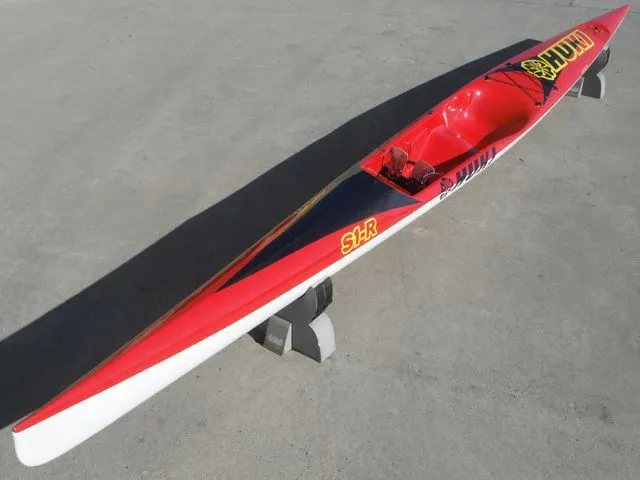 Huki S1-R, three-quarter view from bow, carbon deck on red